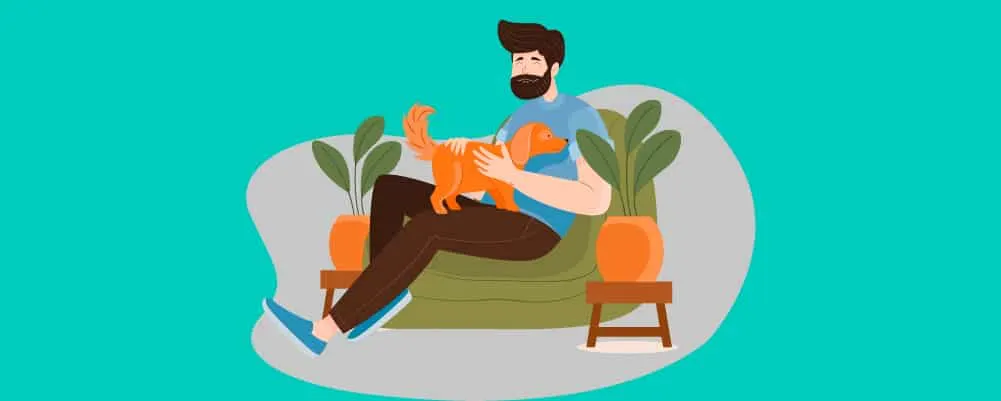 Man petting his dog on a couch