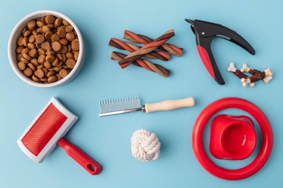 Pet accessories still life concept with grooming objects and food