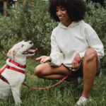 women feeding her dog