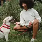 women feeding her dog